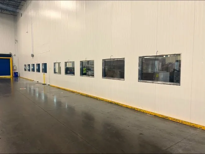 Insulated metal panel wall in a food processing plant