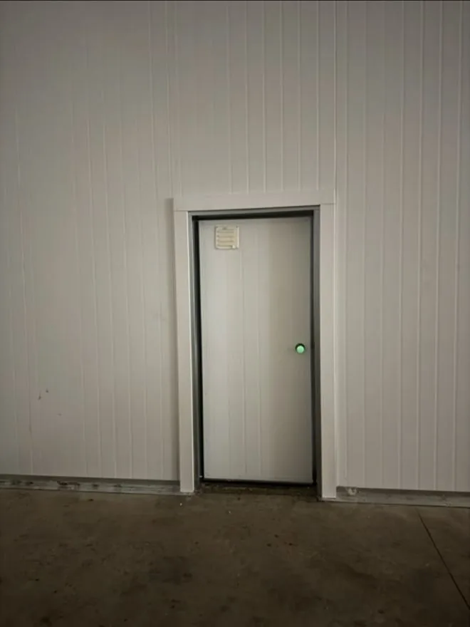 Insulated personnel door for a commercial cold room