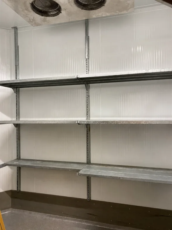 Stocked heavy-duty walk-in cooler shelving