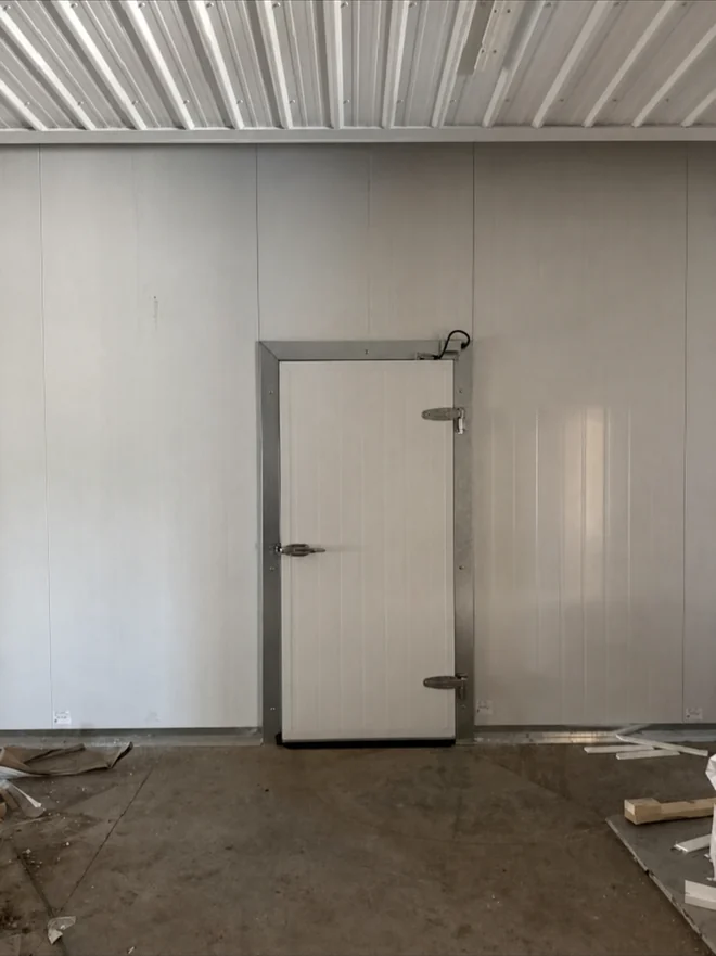 Walk-in freezer swing door with heavy-duty hardware